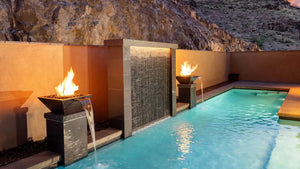 Swimming pool with fire and water bowl features