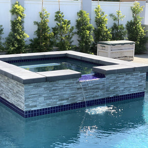 Porcelain ledger stone tile on outdoor spa and swimming pool