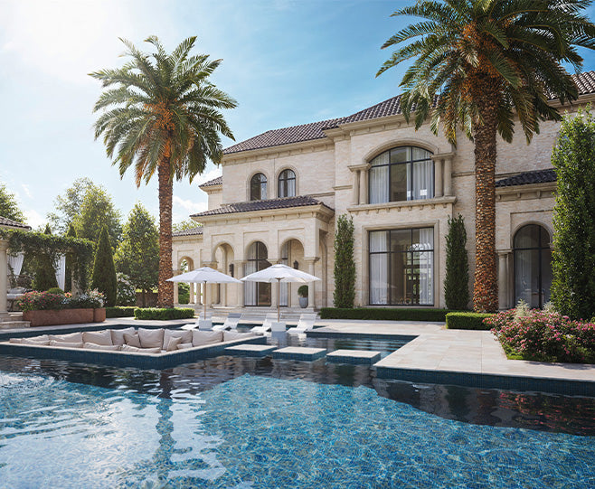 Luxurious mansion with a pool and palm trees on a sunny day