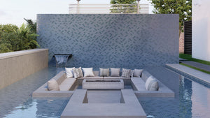 A sunken outdoor lounge area with fire pit table and blue mosaic glass tile accent walls