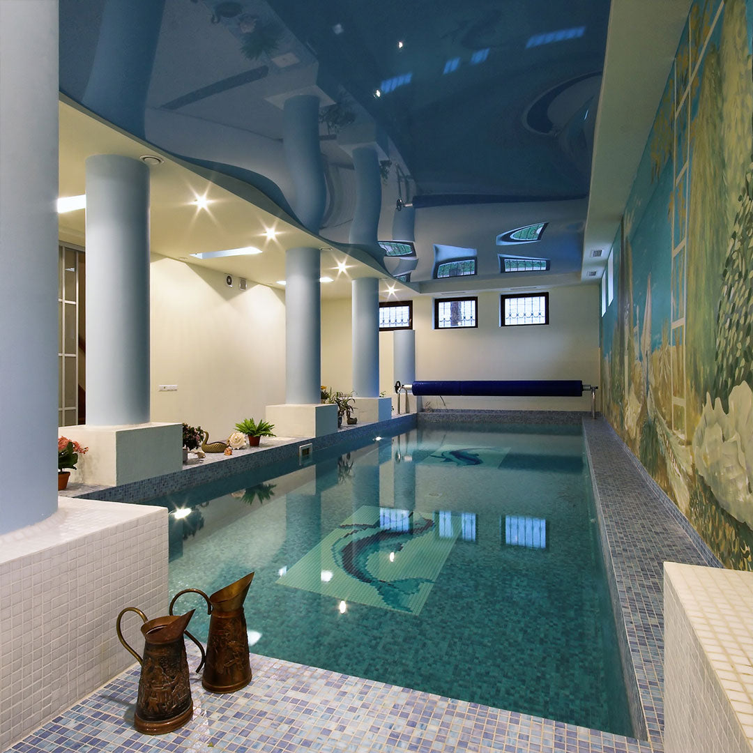 Gray gradient glass mosaic tile in an indoor swimming pool