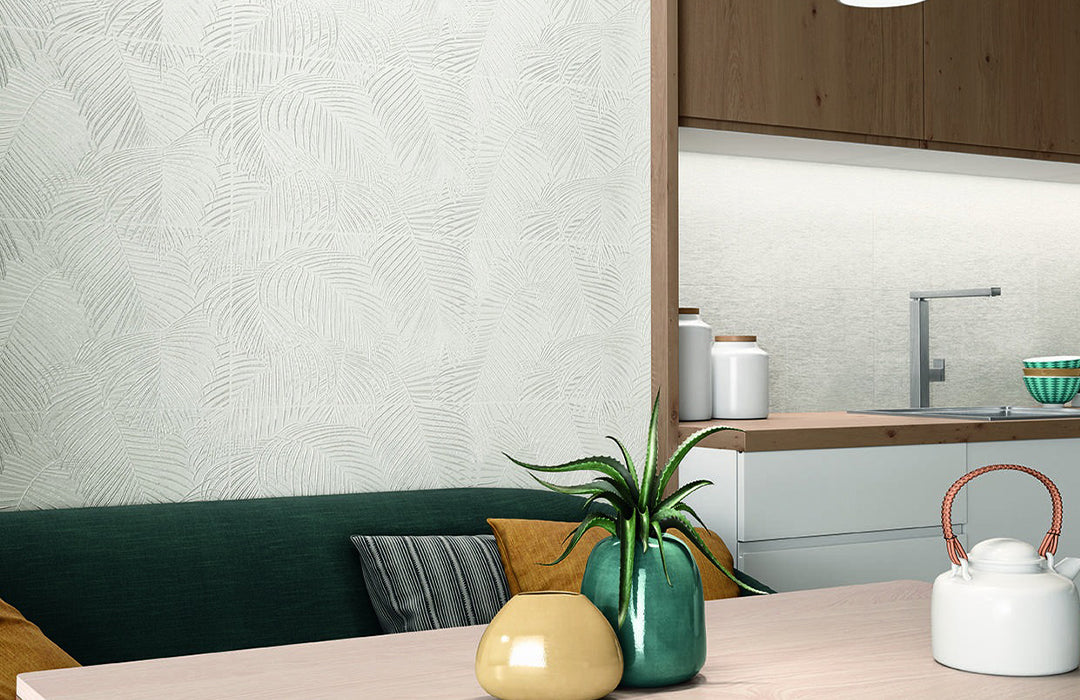 Kitchen interior with a table, decorative items, and a view of the kitchen.