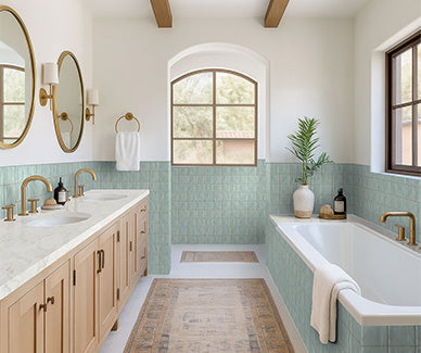 Bathroom with green tiled walls, wooden vanity, and bathtub.