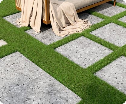 Outdoor patio with grassy area and concrete tiles
