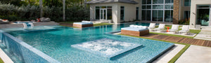 Outdoor living space with swimming pool, patio furniture, porcelain pavers, and artificial turf