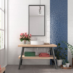 Blue fish scale glass mosaic tile and white subway tile on bathroom vanity wall