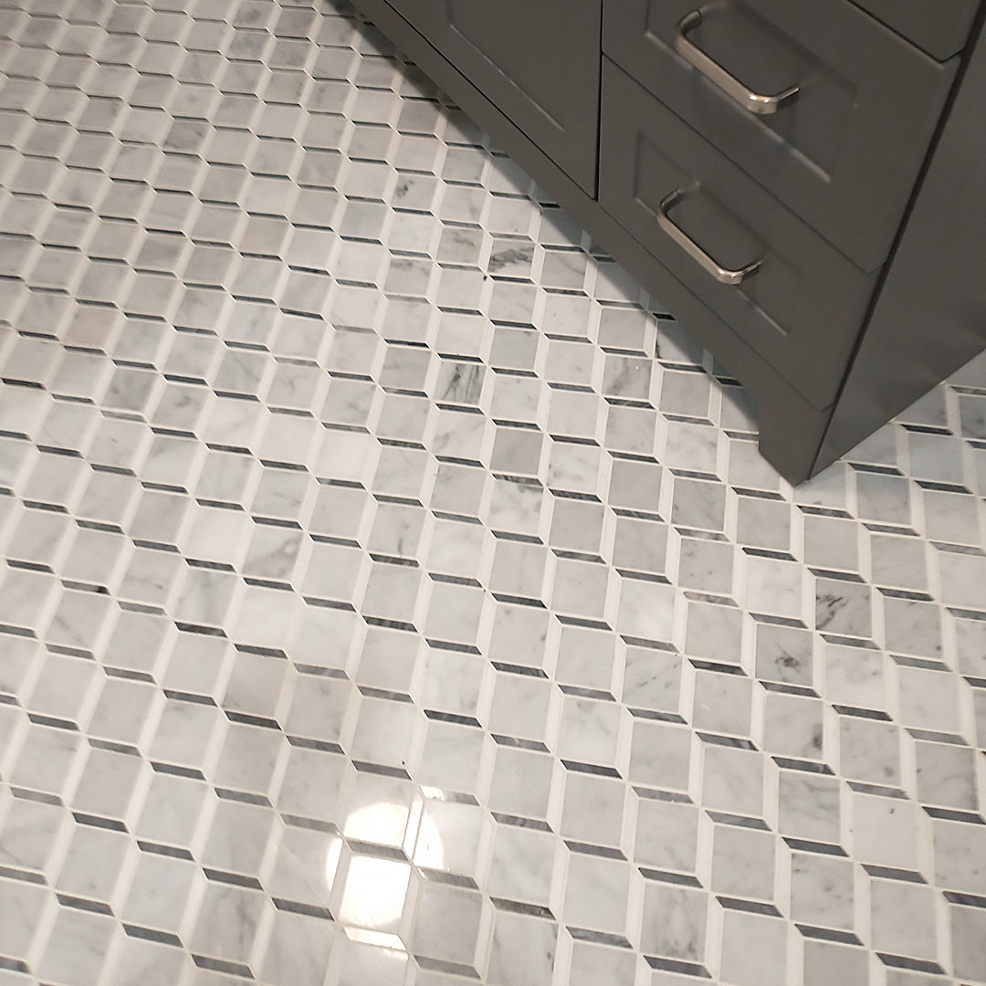 Classic grout tile with geometric tile on bathroom floor