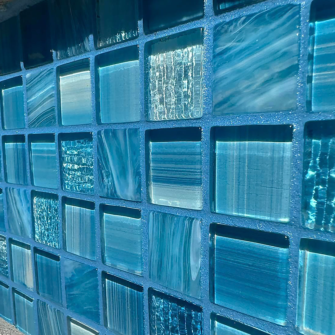 Blue glass tile grout with blue pool tile