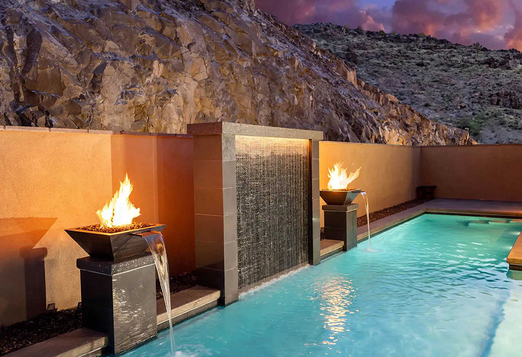 Swimming pool with fire and water bowl features