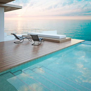 All glass tile swimming pool and patio furniture