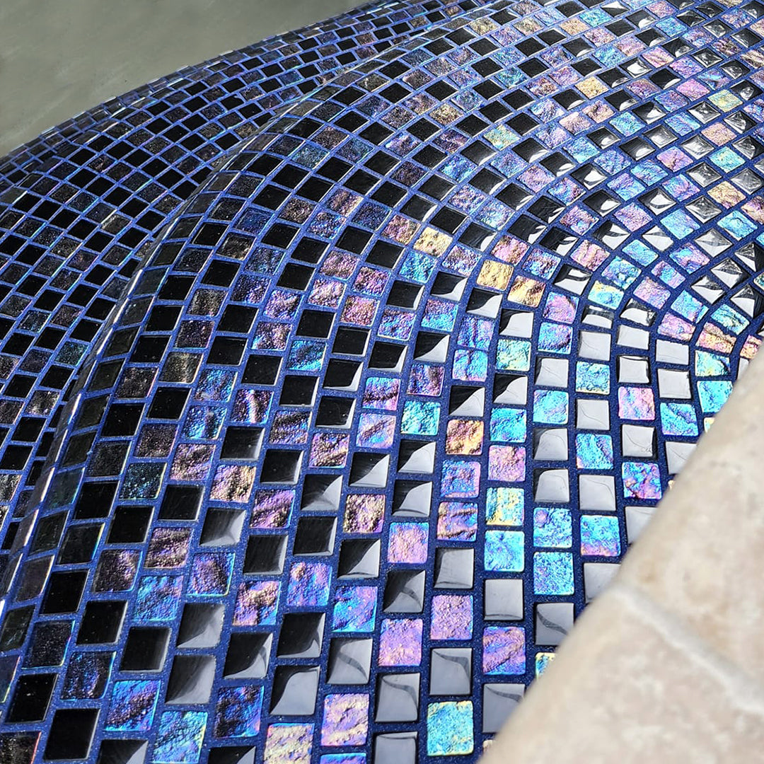 Iridescent black mixed glass tile with colored epoxy-based tile grout