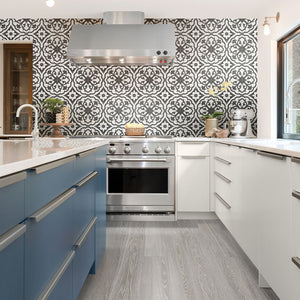 Black and white large format pattern tile on kitchen backsplash