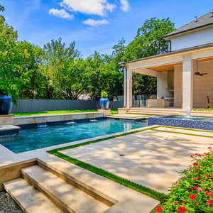 Outdoor living space with porcelain pavers and swimming pool