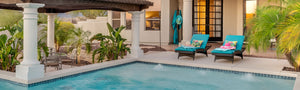 Outdoor living space with swimming pool, porcelain patio pavers, and outdoor patio furniture