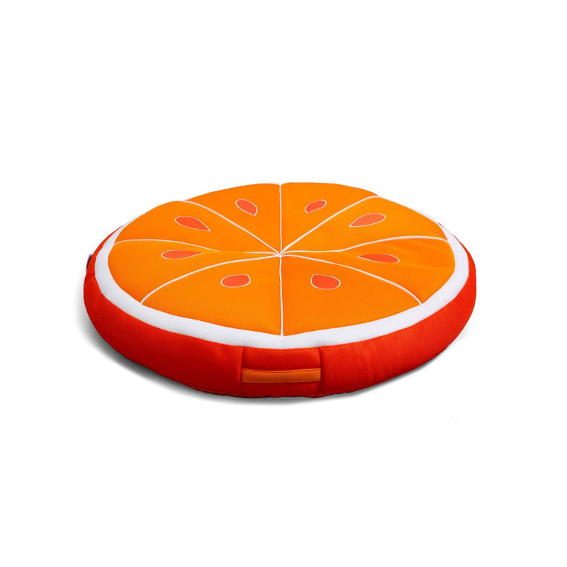Round orange slice cushion on a white background