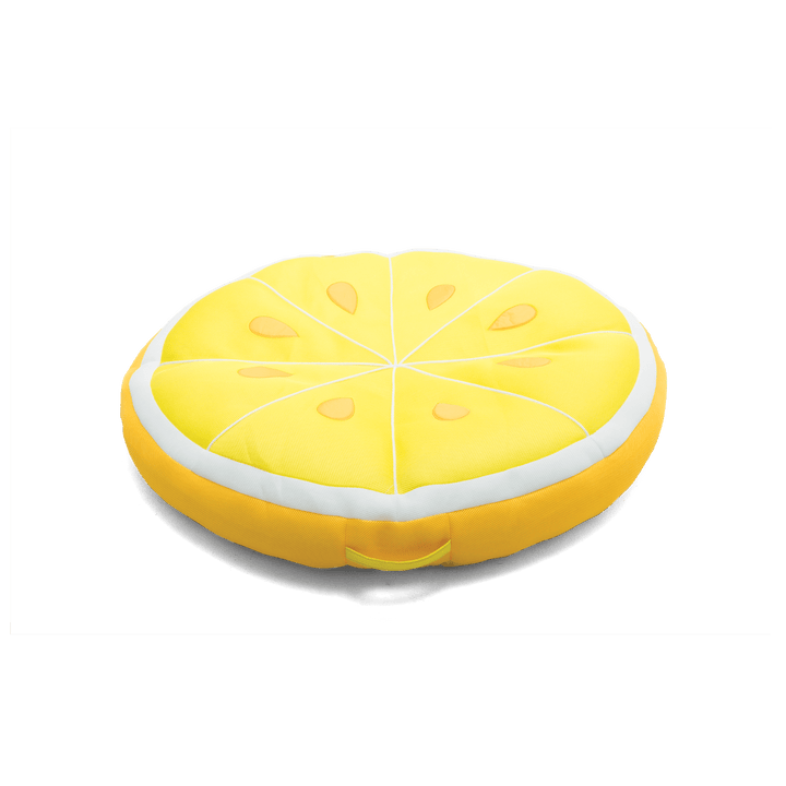 Yellow lemon-shaped cushion on a black background