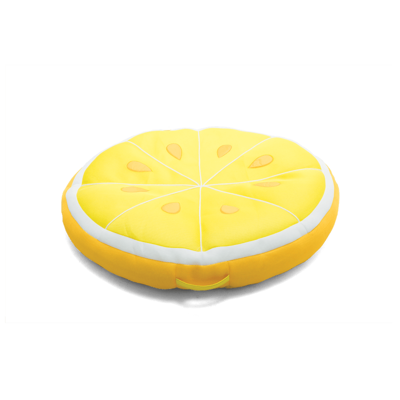Yellow lemon-shaped cushion on a black background