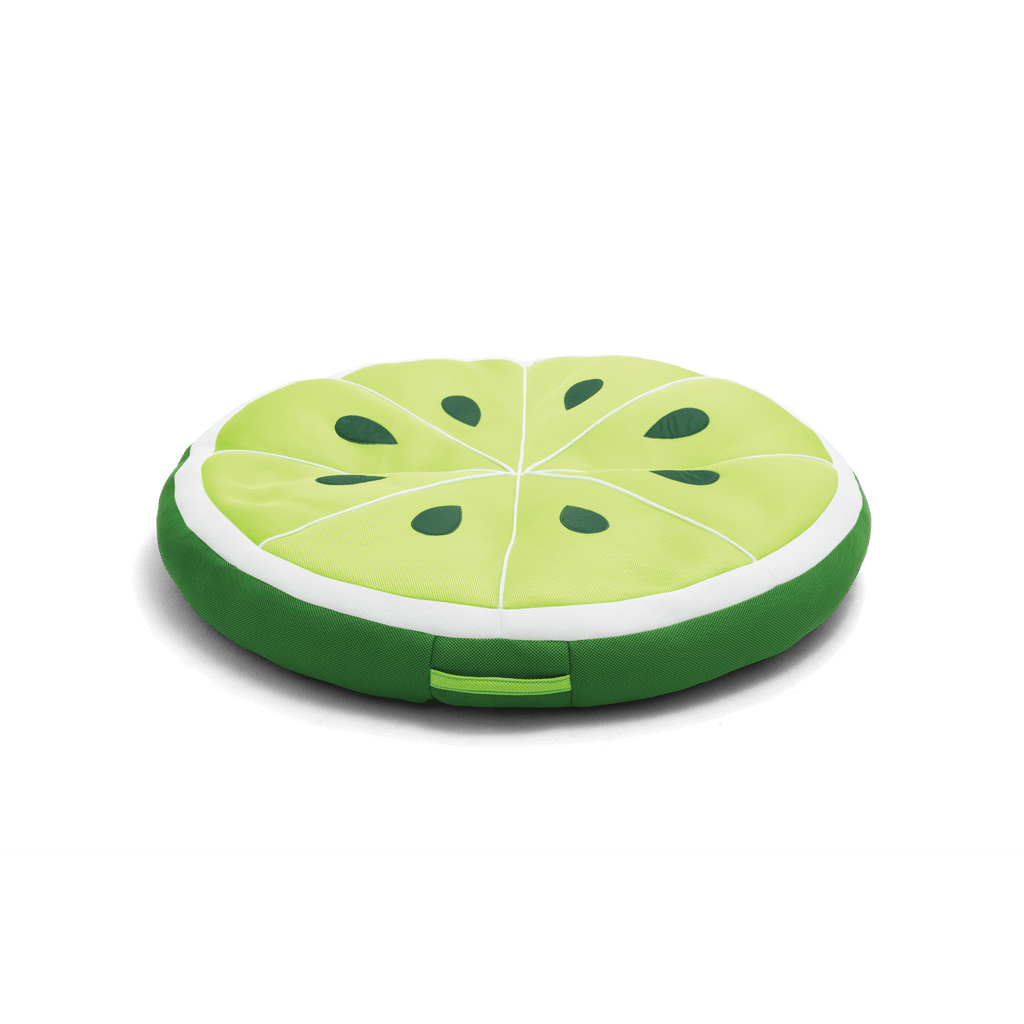 Round green cushion shaped like a watermelon slice on a black background