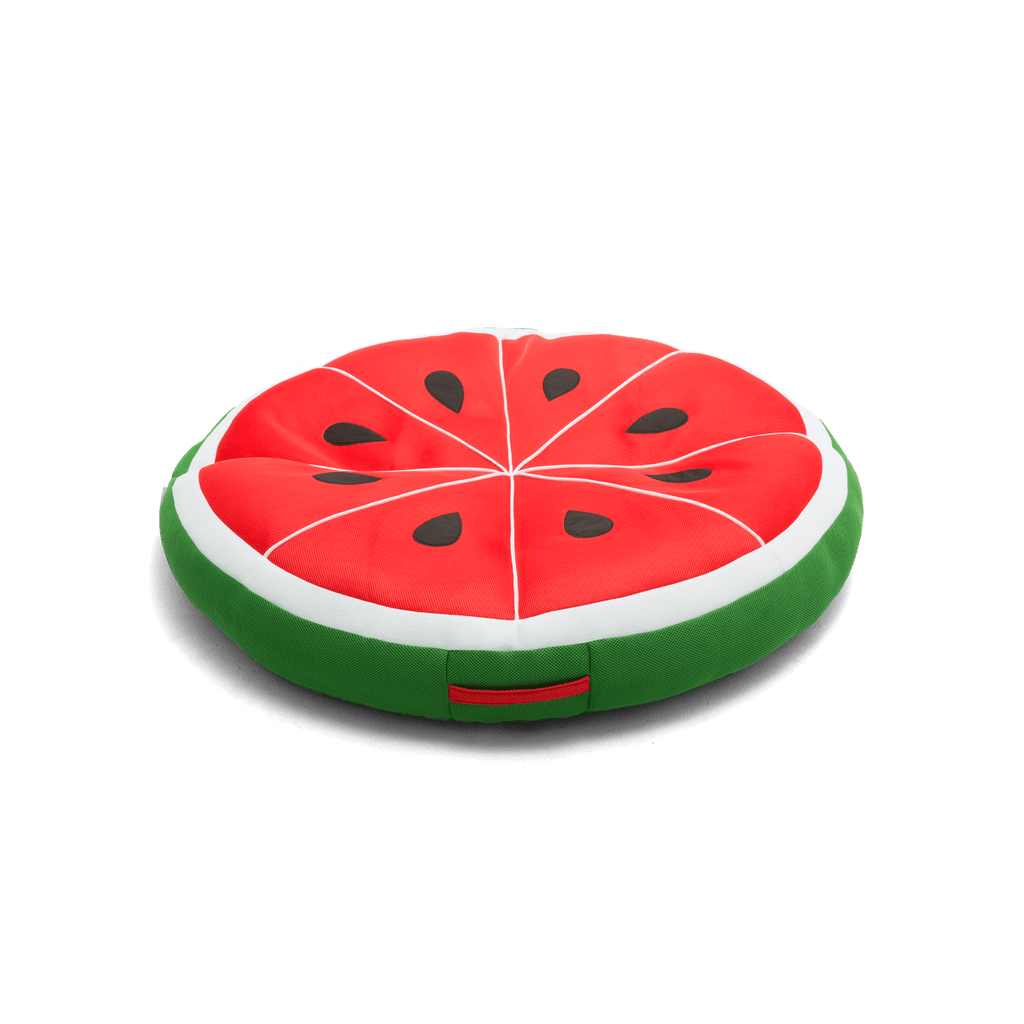 Watermelon slice-shaped cushion on a black background