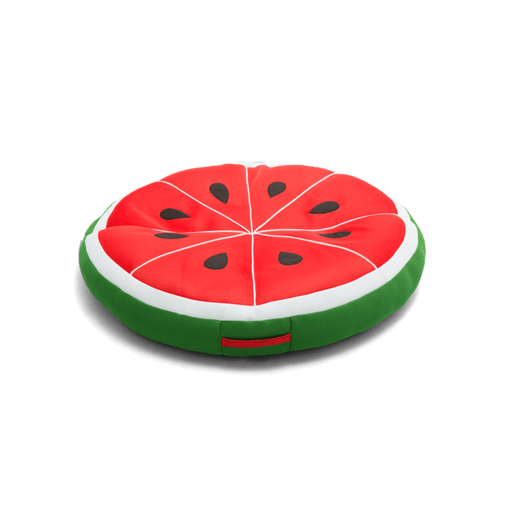 Watermelon slice-shaped cushion on a black background