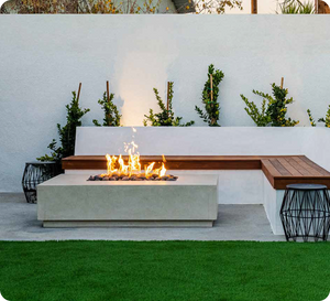 Outdoor living space with fire pit table, patio furniture, and artificial turf