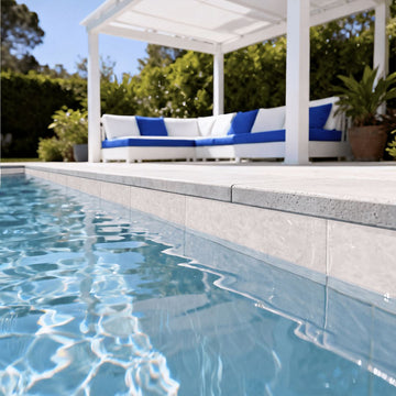 Alps White porcelain pool tile with outdoor furniture in the background