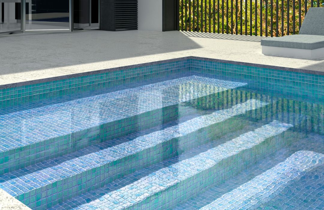aqua pool tiles covering stairs in a pool