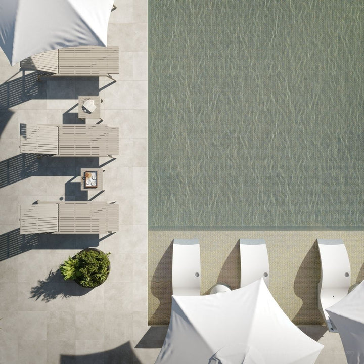 Top-down view of outdoor furniture by a pool with water pattern.