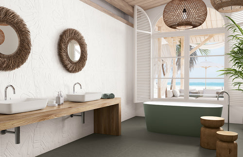 Modern bathroom with wooden vanity, green bathtub, and large windows.