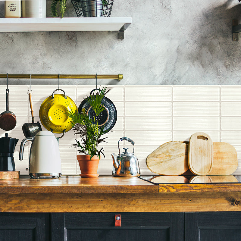 White porcelain subway tile on kitchen backsplash