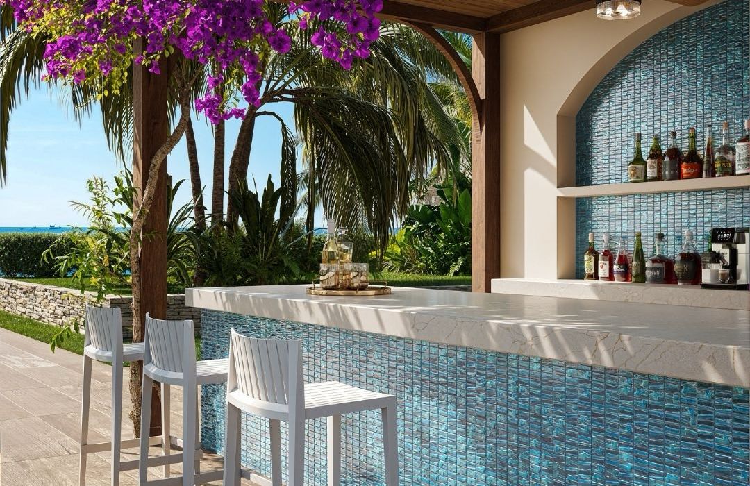 blue mosaic glass tile in outdoor and kitchen and bar area with barstools