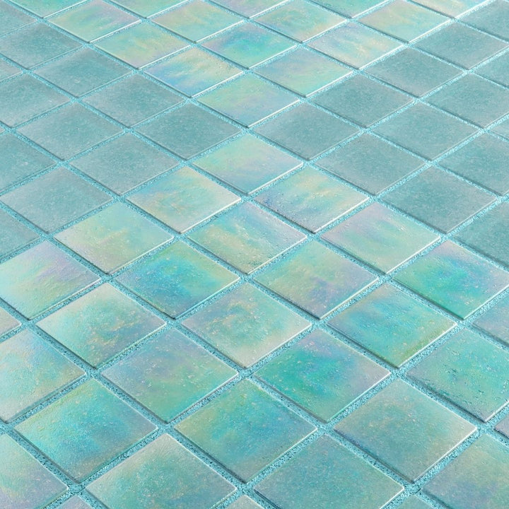 Close-up of a grid of teal tiles with a subtle gradient.