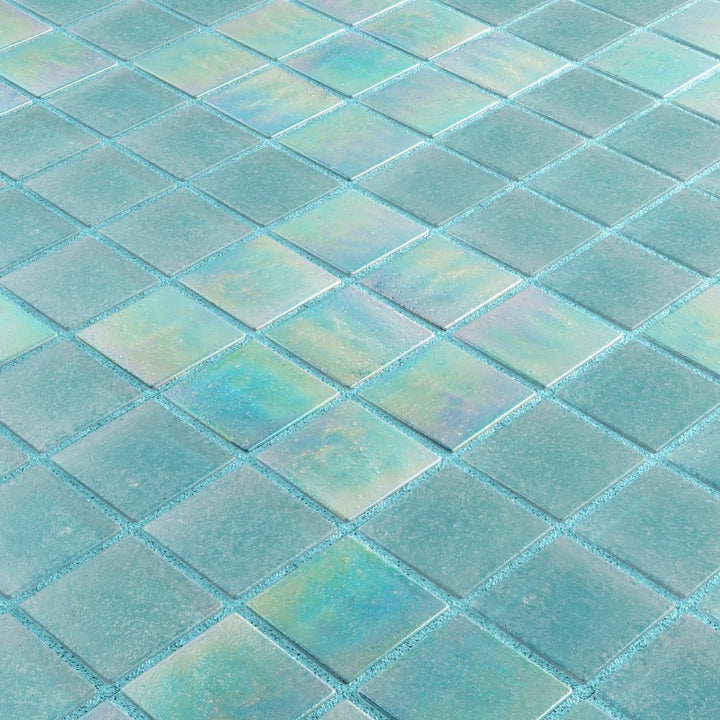 Close-up of iridescent glass mosaic tiles in a grid pattern