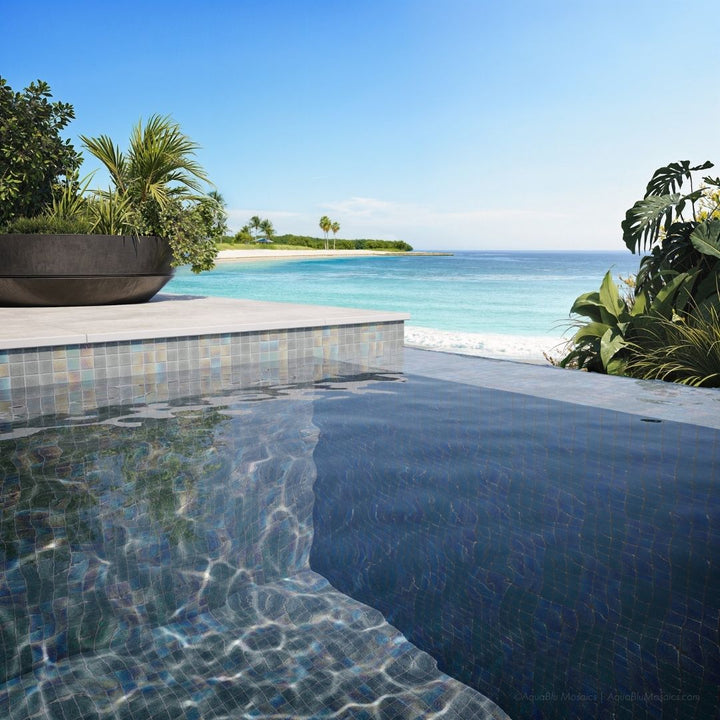 Pool area with tiled edge and ocean view