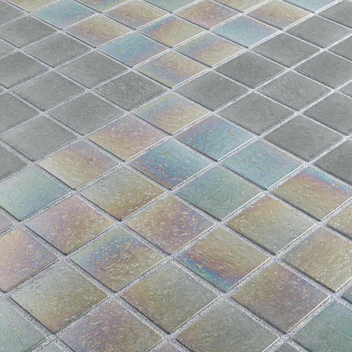 Close-up of a grid of square tiles with a metallic sheen