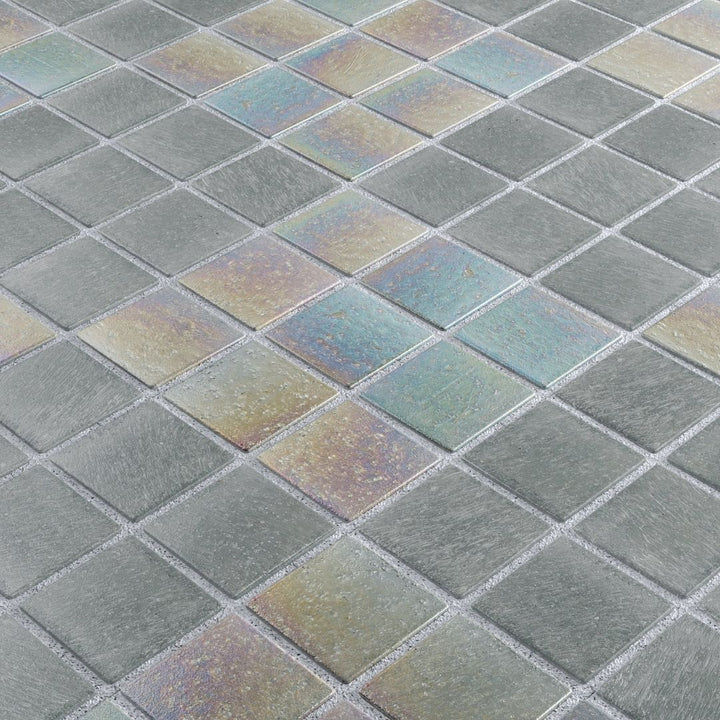 Close-up of iridescent glass mosaic tiles in a grid pattern