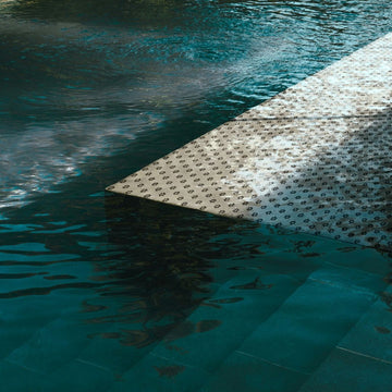 Cardin Bone Glass Mosaic Tile in a swimming pool 