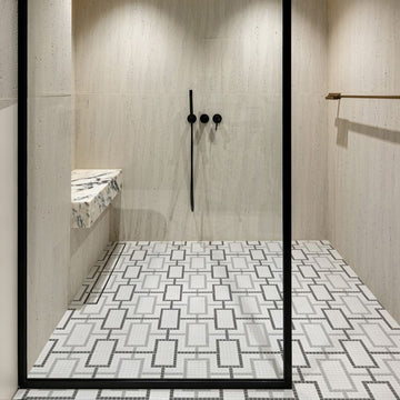 cardin haven glass mosaic tile with a shower and ledge