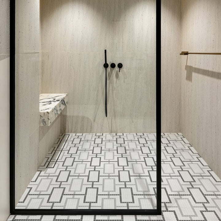 cardin haven glass mosaic tile with a shower and ledge