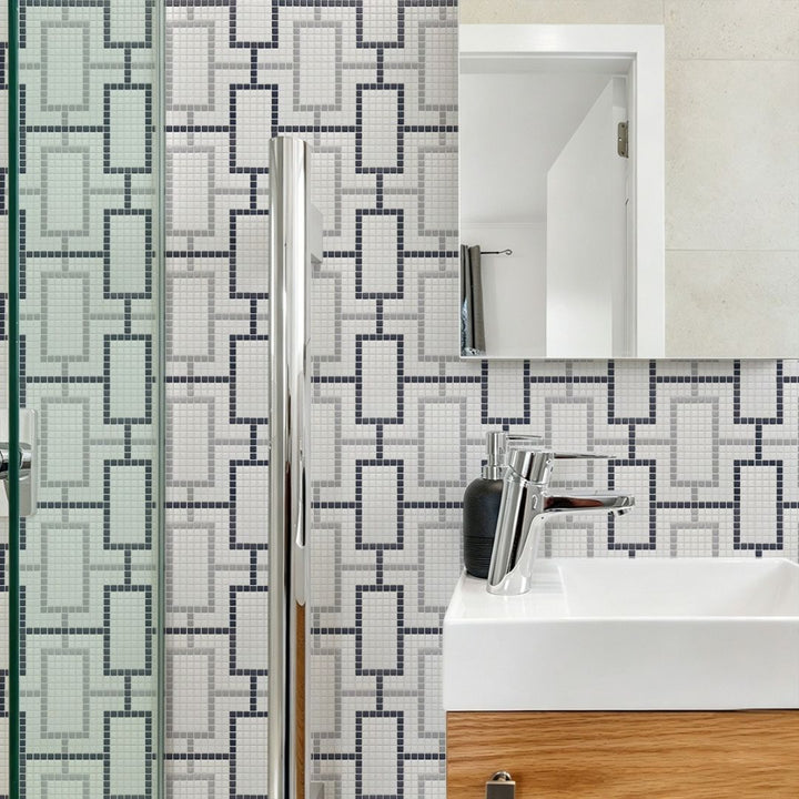 cardin haven glass mosaic tile with a sink and mirror