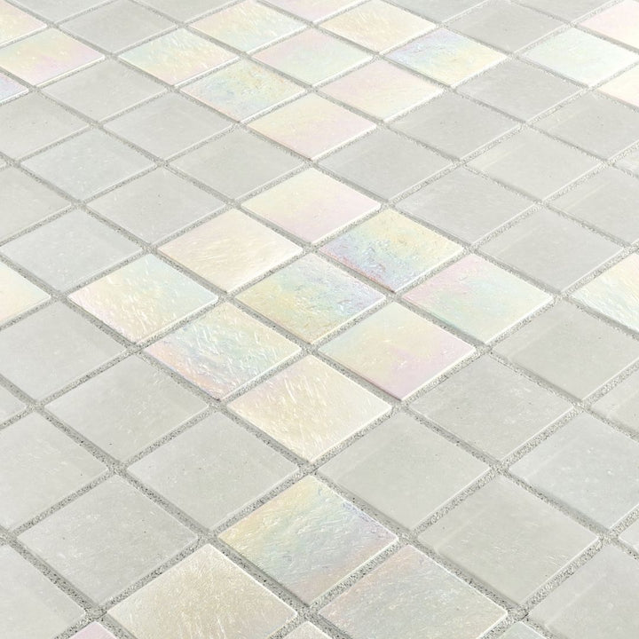 Close-up of iridescent glass mosaic tiles in a grid pattern