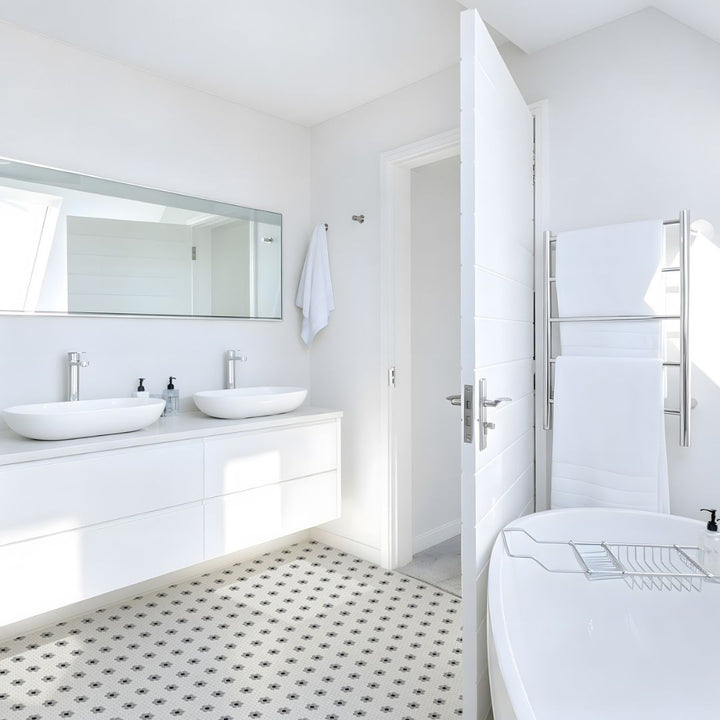 Coco Haven Glass Mosaic Tile with two sinks, a bathtub and a mirror