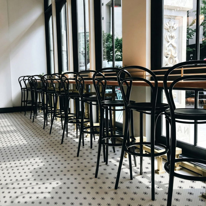Coco Haven Glass Mosaic Tile at a restaurant with chairs and windows