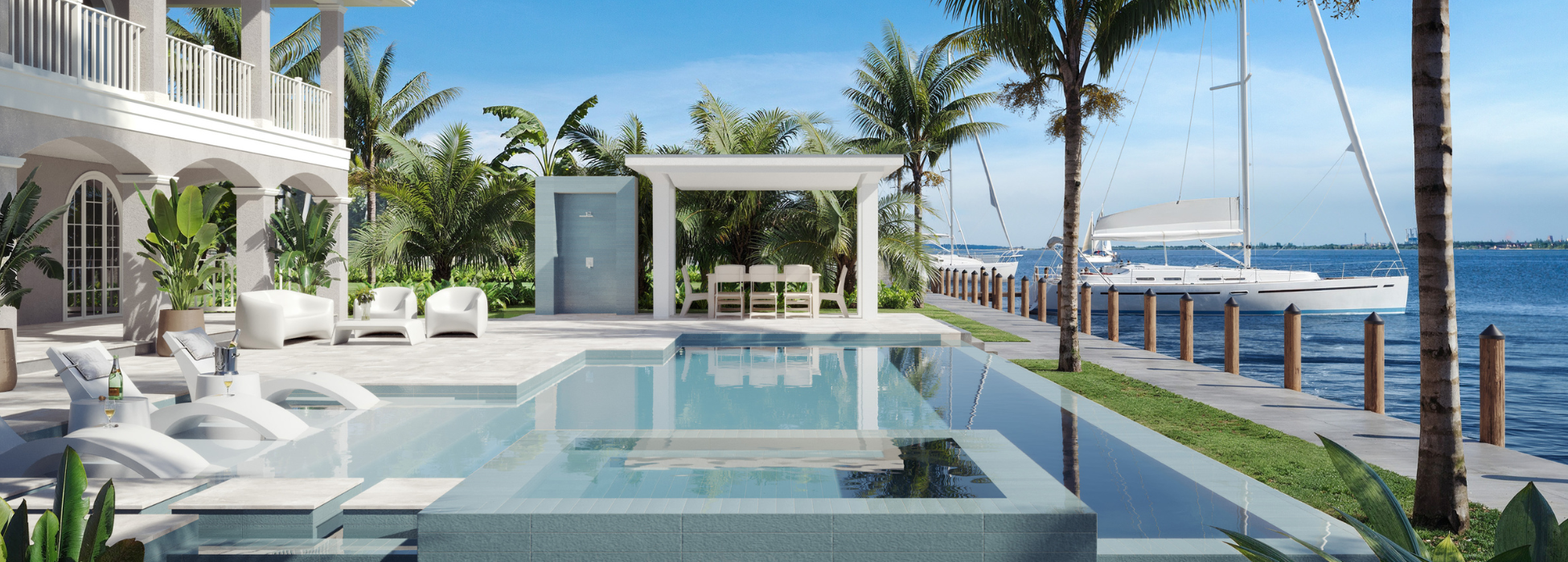 Modern outdoor living area with pool, lounge chairs, and ocean view.