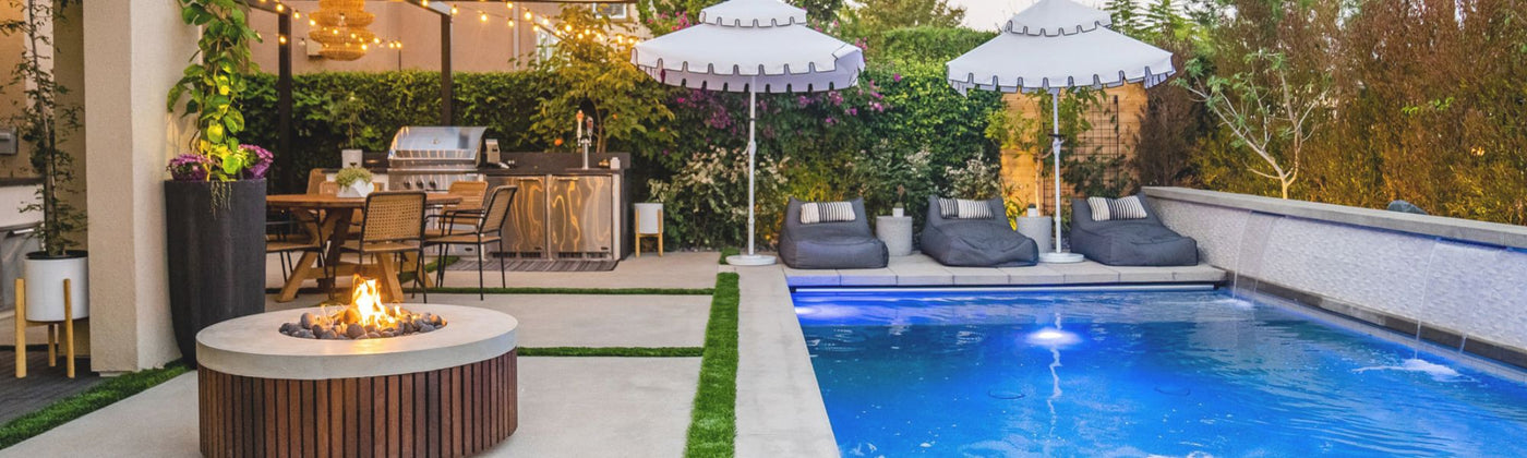 Outdoor patio with pool, fire pit, and lounge chairs