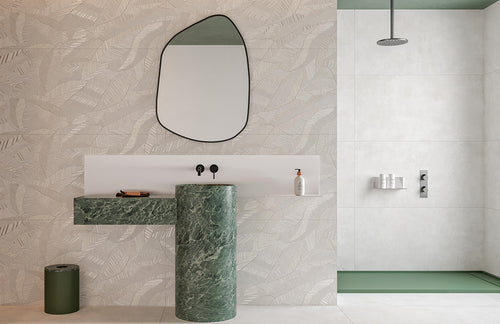 Bathroom with green marble sink and patterned wall