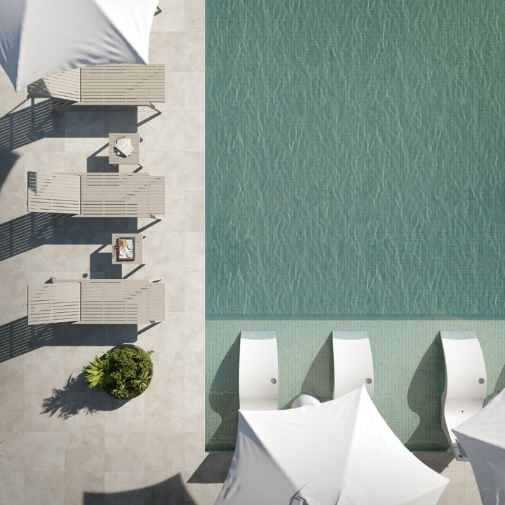 Top-down view of outdoor furniture by a pool with water pattern.