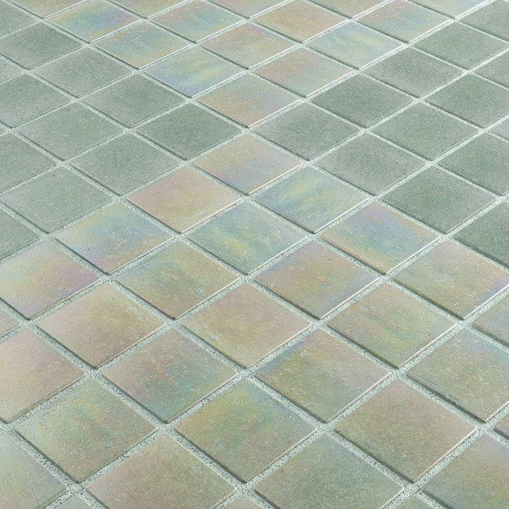 Close-up of a tiled floor with green and brown tiles