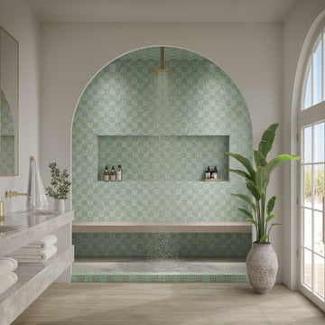 Modern bathroom with green mosaic tile wall and large window