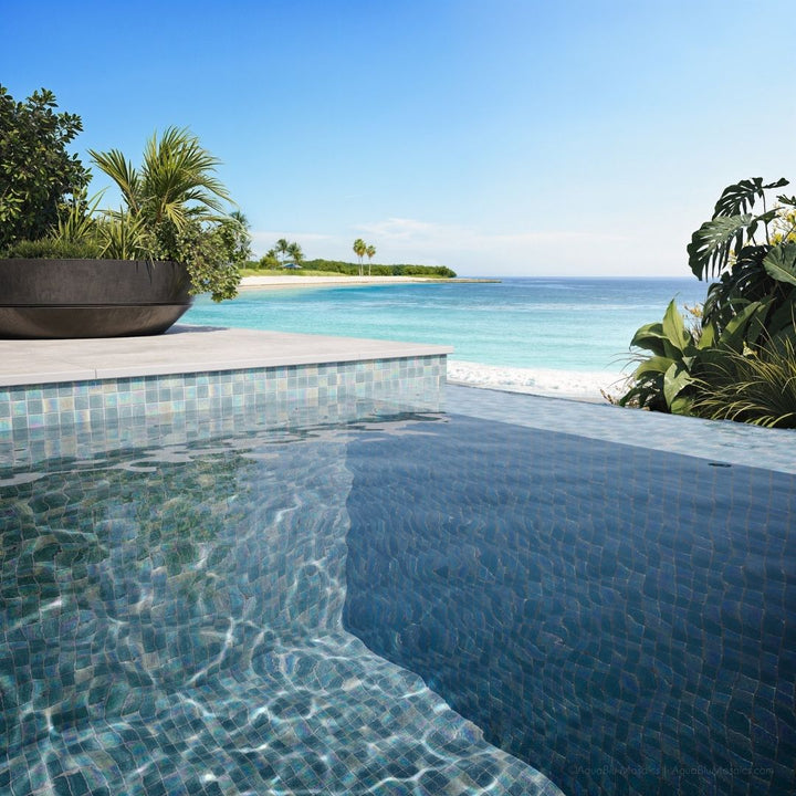 Pool area with tiled edge and ocean view
